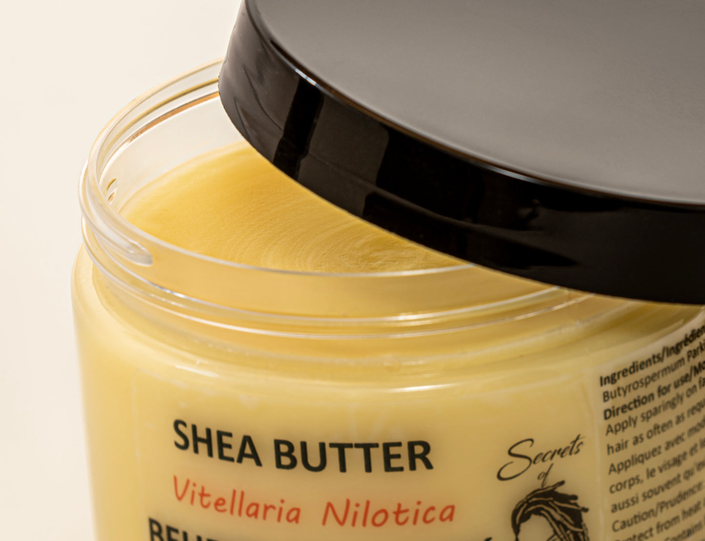 400ml Jar of Nilotica Shea Butter on a White Background Open Jar