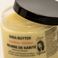 400ml Jar of Nilotica Shea Butter on a White Background Open Jar
