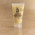 50ml Tube of Nilotica Shea Butter on a Brown Background