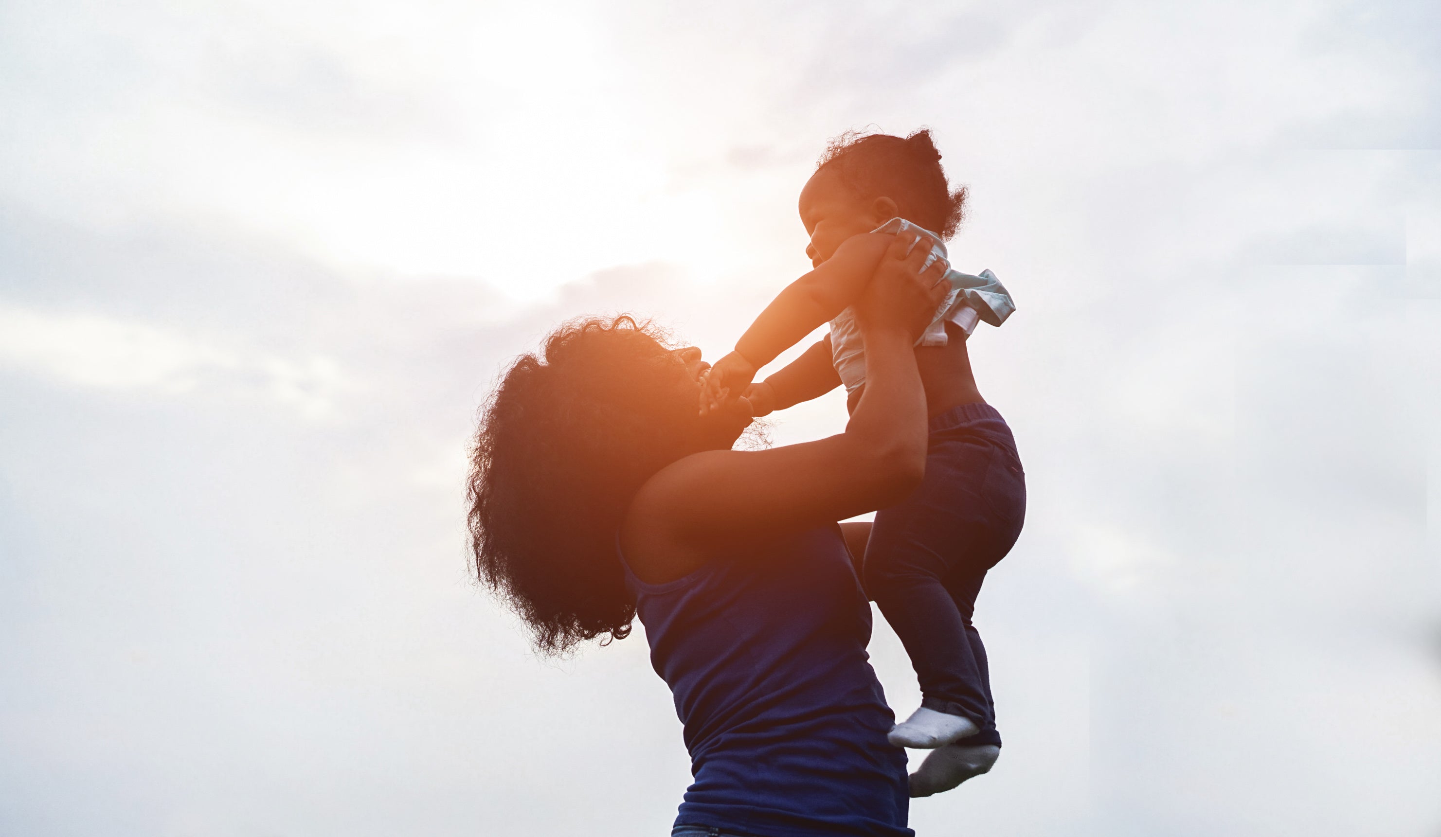 Mother holding up a child